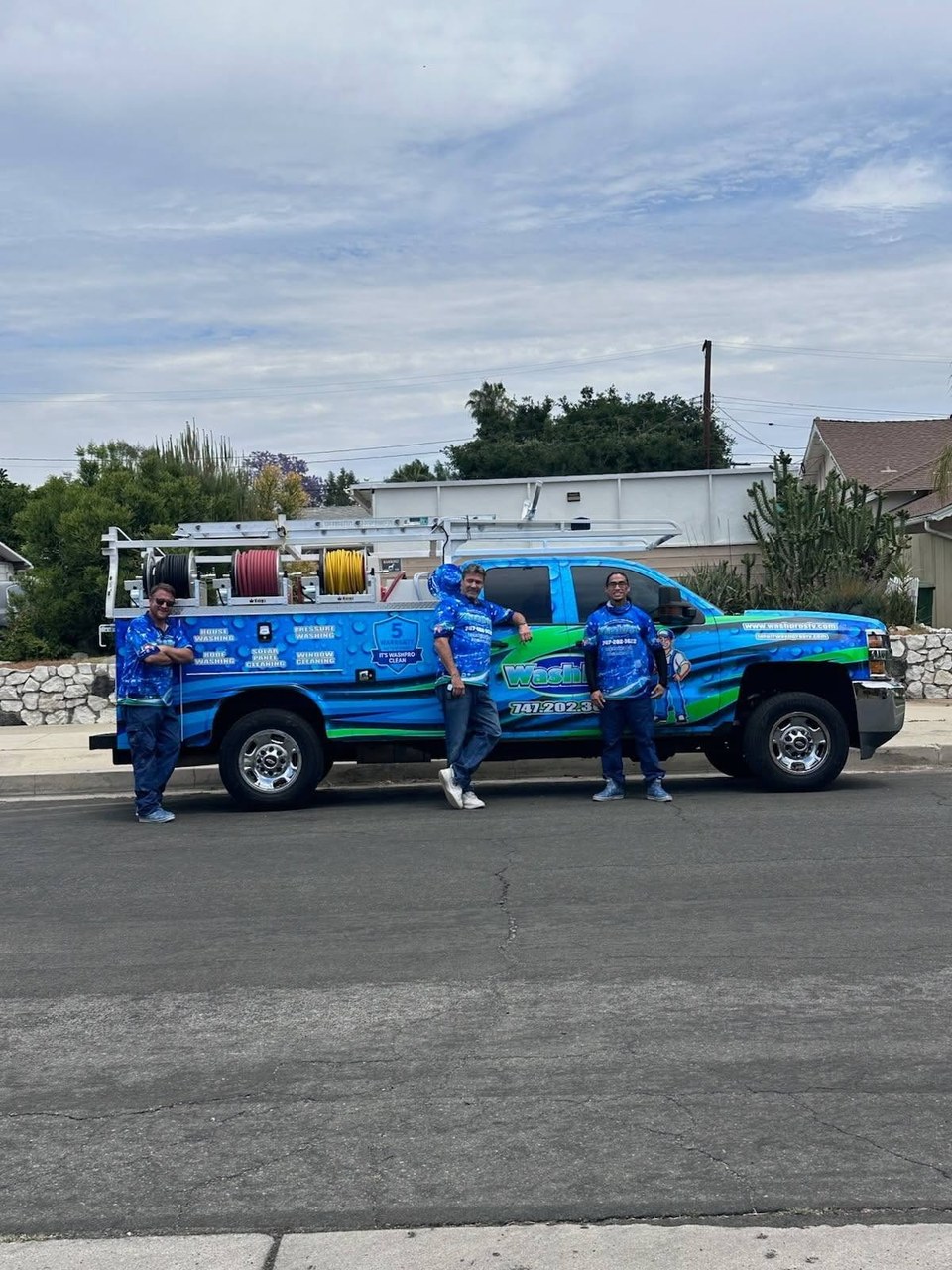 The WashPro SFV family crew standing with their branded van in the San Fernando Valley, California