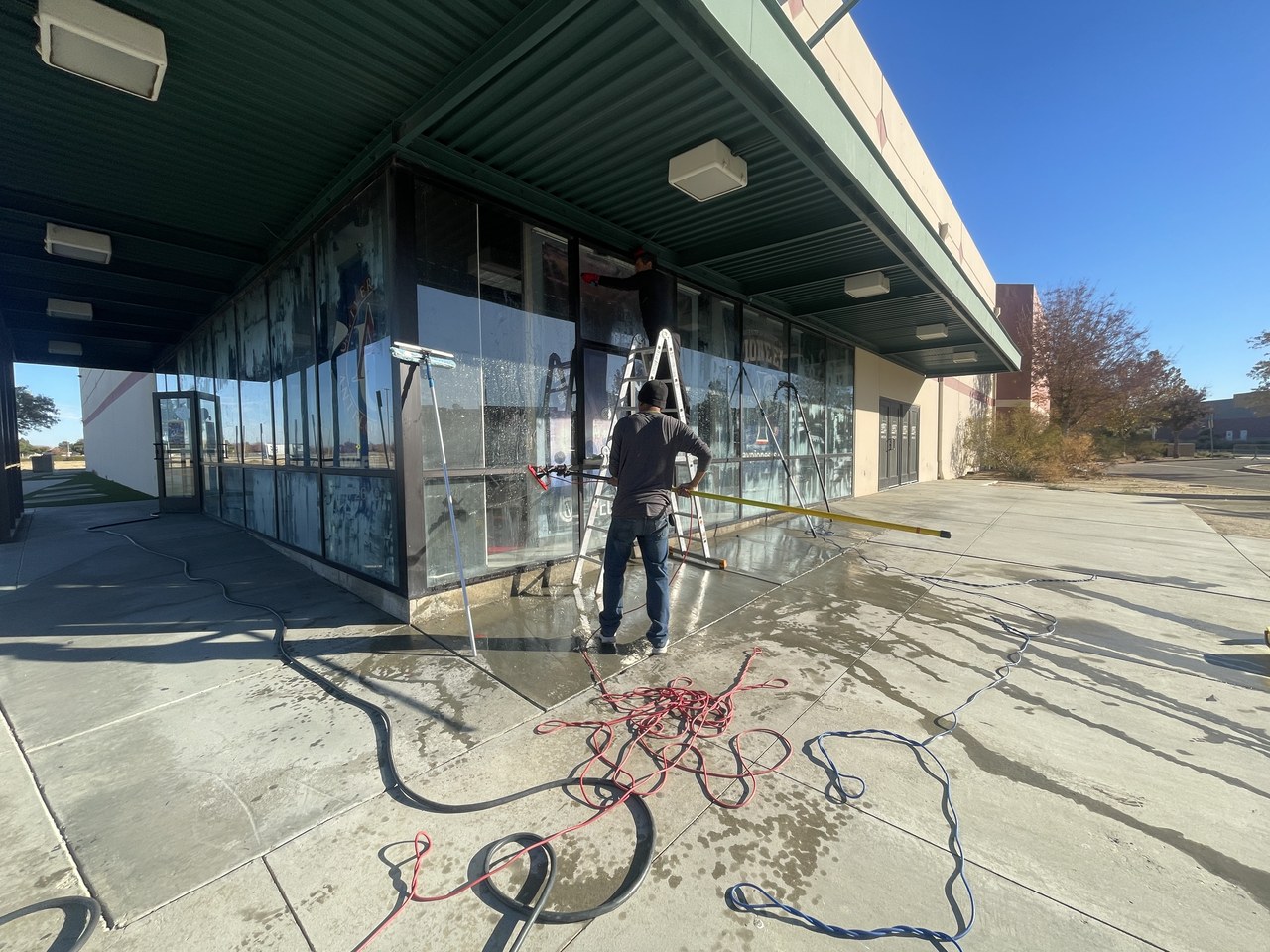 Post-construction cleaning of a newly built modern home with floor-to-ceiling glass in Los Angeles